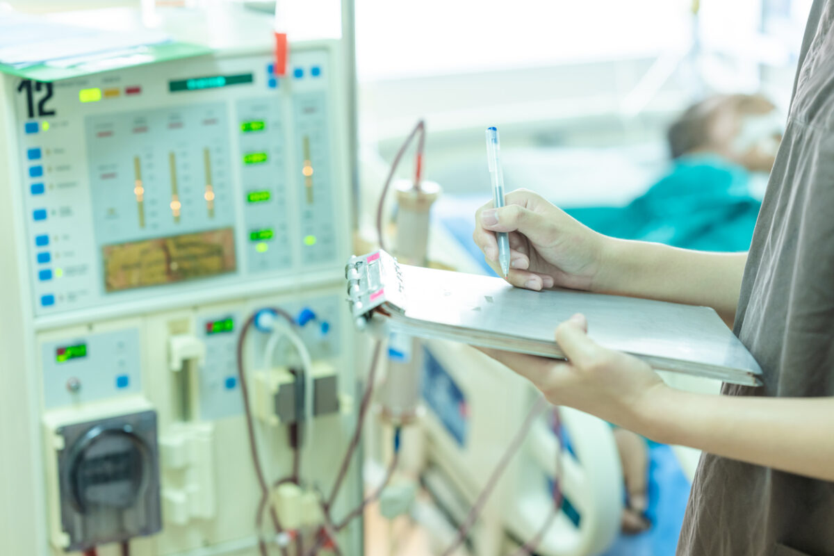 Specialist checking machine in hospital